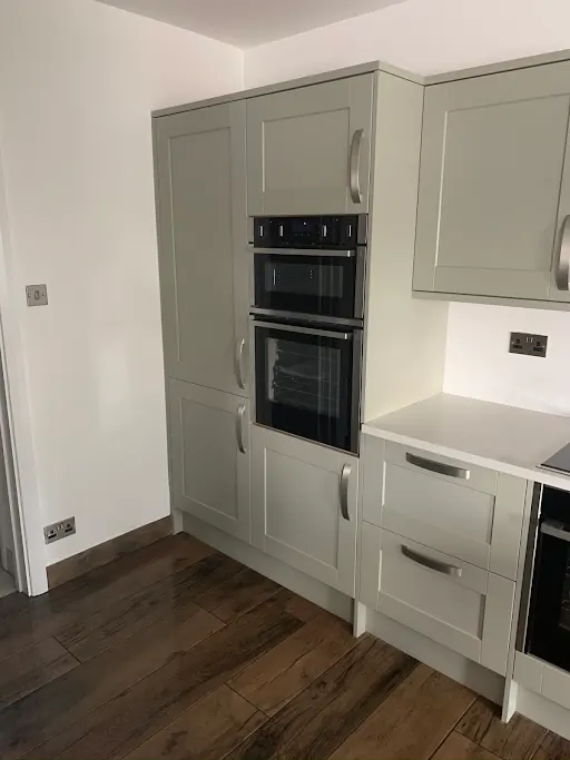 Bespoke sage green kitchen with double oven, Bexley
