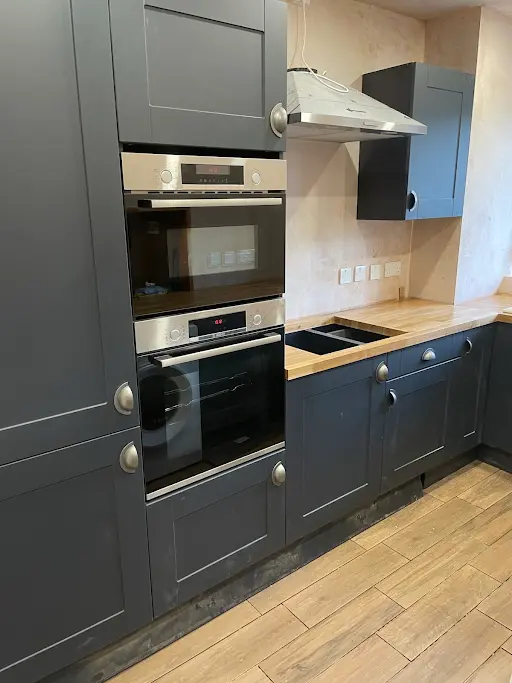 Renovated navy shaker kitchen with double oven, Bexley