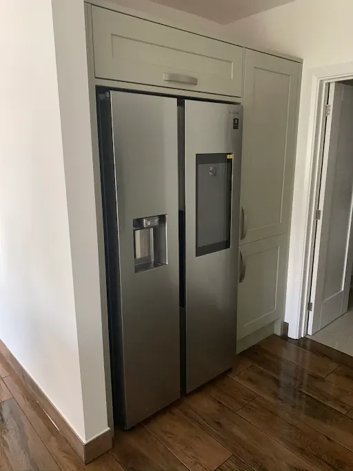 Bespoke sage green kitchen with larder fridge, Bexley