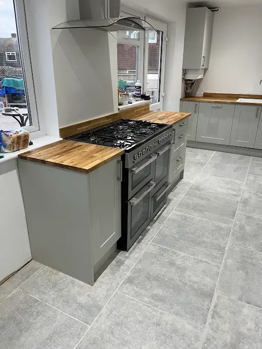 Bespoke fitted kitchen with range cooker and island, Bexley