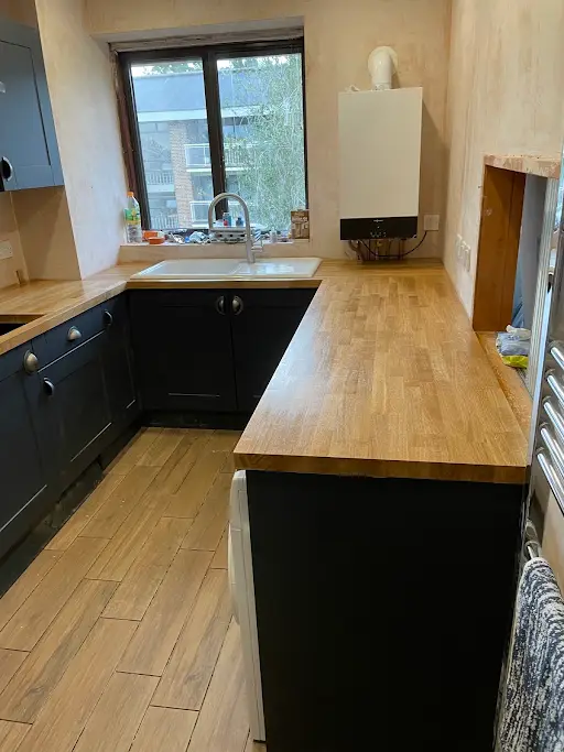 Navy shaker kitchen renovation with solid oak worktop, install in progress, Bexley
