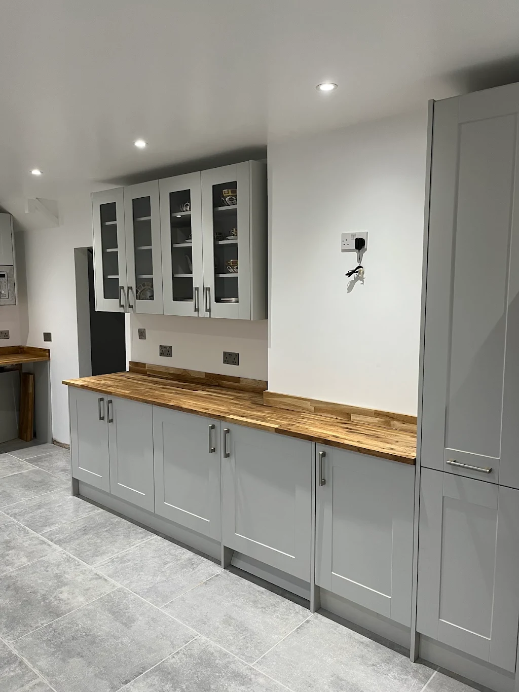 Fitted grey shaker kitchen installation with quartz worktop, Bexley