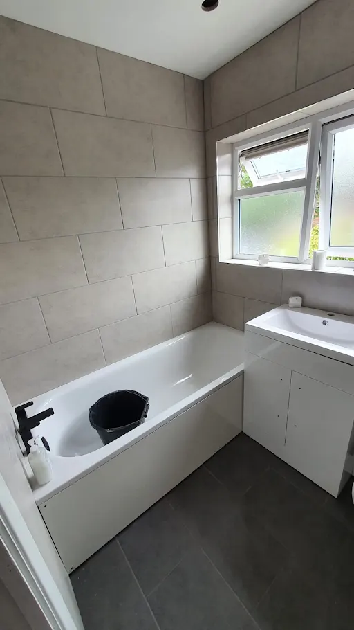 Newly installed bathroom with matte black tap and freestanding bath, Bexley